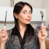 Por que a mulher sente mais fome na menopausa?